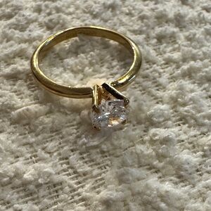 Elegant Gold tone Ring with Clear Stone
